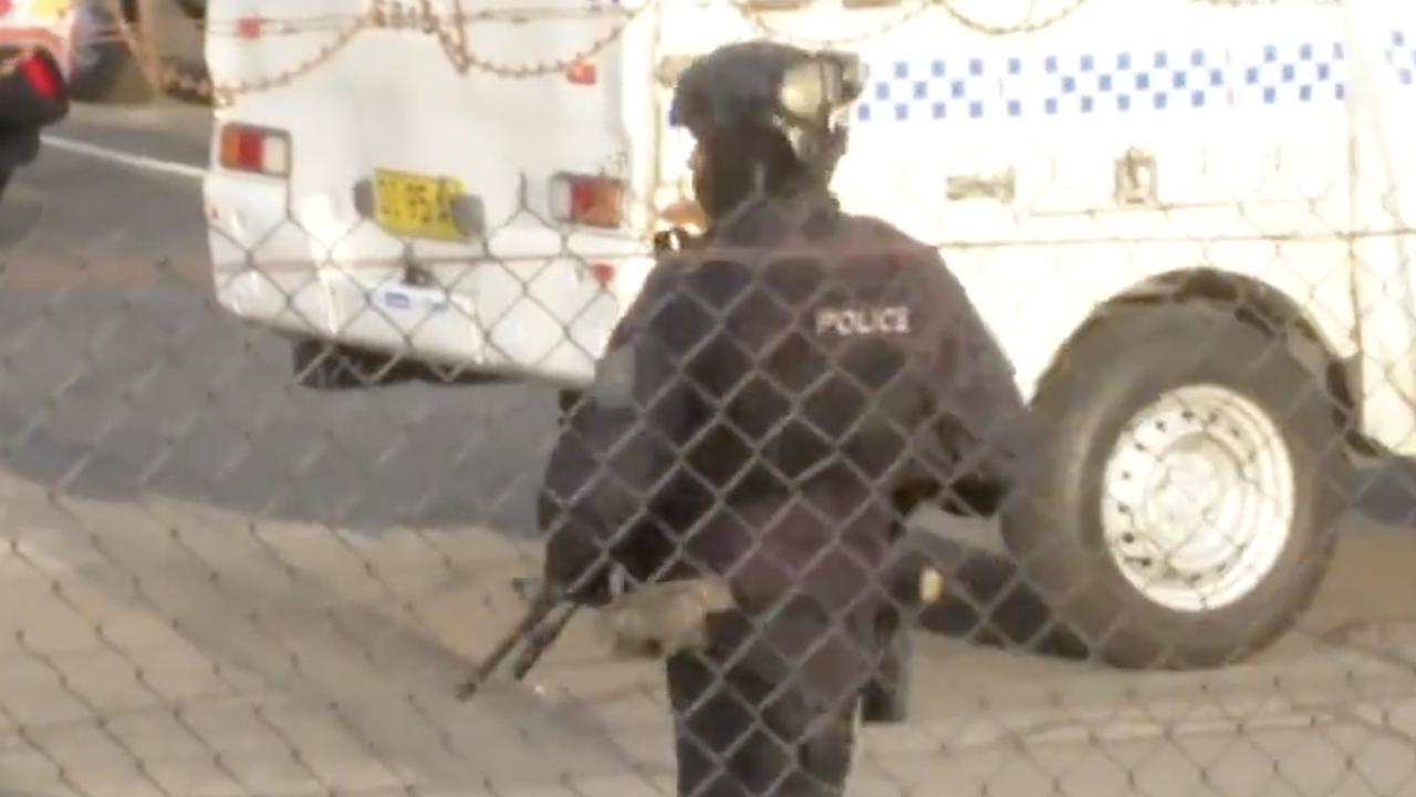 Heavily armed officers were seen responding to the security issue. Picture: 7News