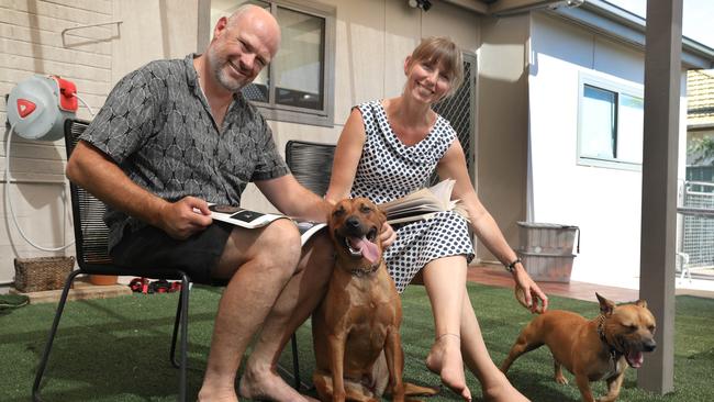 Kalie and Will, with their dogs, Latch and Frank who are happy to have their own back yard. Picture: Dean Martin