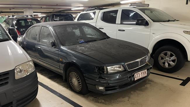 An abandoned Nissan Maxima 30G at the Uptown shopping complex car park. Photo: Supplied