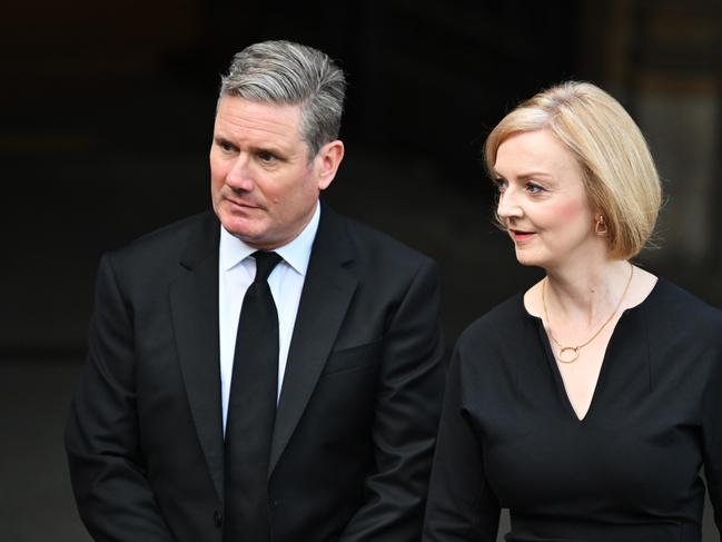 LONDON, ENGLAND - SEPTEMBER 12: Labour party leader Sir Keir Starmer and UK prime minister Liz Truss leave the Palace of Westminster after the presentation of Addresses by both Houses of Parliament in Westminster Hall at the Houses of Parliament on September 12, 2022 in London, England. The Lord Speaker and the Speaker of the House of Commons presented an Address to His Majesty on behalf of their respective House in Westminster Hall following the death of Her Majesty Queen Elizabeth II.  The King replied to the Addresses. Queen Elizabeth II died at Balmoral Castle in Scotland on September 8, 2022, and is succeeded by her eldest son, King Charles III.  (Photo by Leon Neal/Getty Images)