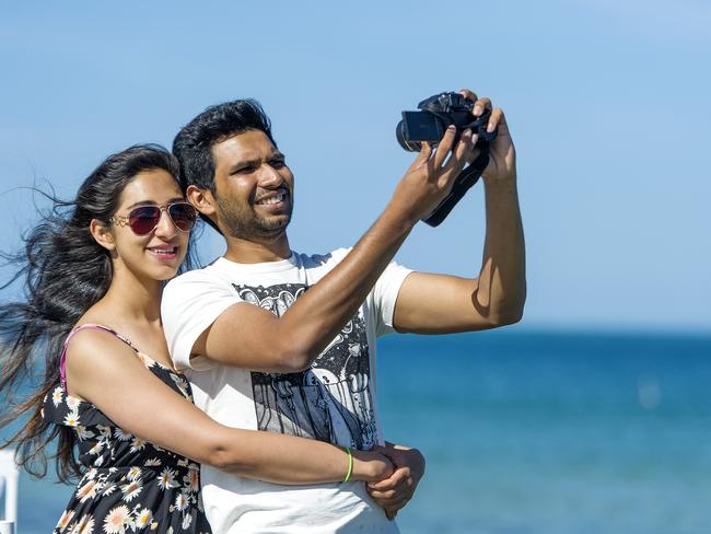 Sindhu Ravihchandran and Kardik Kiran take a New Year’s Eve 2014 selfie at Sorrento. Picture: Eugene Hyland