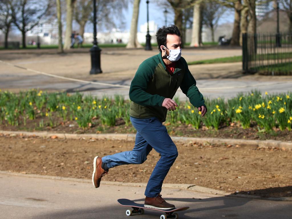 A man skateboards at London’s Hyde Park on February 21 as daily cases and deaths decline and the government sketches out reopening plans. Picture: Hollie Adams/Getty Images