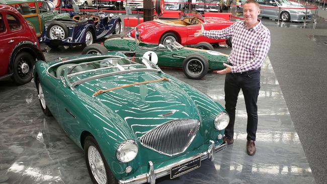 Gosford Classic Car Museum owner Tony Denny with some of the new cars at the museum. For summer guide.Picture by Mark Scott