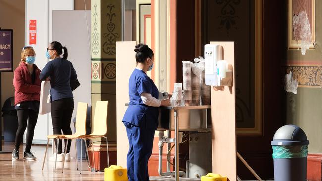 Nursing staff at the mass vaccination hub at the Royal Exhibition Building. Picture: Getty Images