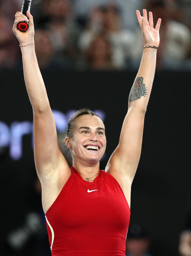 Aryna Sabalenka celebrates match point against Zheng Qinwen on Rod Laver Arena. Picture: Martin Keep/AFP.