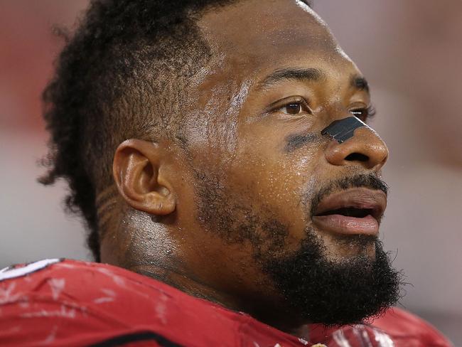 GLENDALE, AZ - NOVEMBER 24: Defensive end Darnell Dockett #90 of the Arizona Cardinals watches from the bench during the NFL game against the Indianapolis Colts at the University of Phoenix Stadium on November 24, 2013 in Glendale, Arizona. The Cardinals defeated the Colts 40-11. (Photo by Christian Petersen/Getty Images)