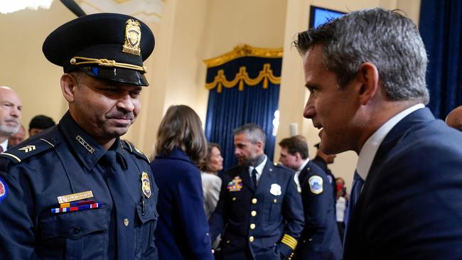 US Capitol Police Sgt. Aquilino Gonell with Republican congressman Adam Kinzinger after giving his testimony. Picture: AFP