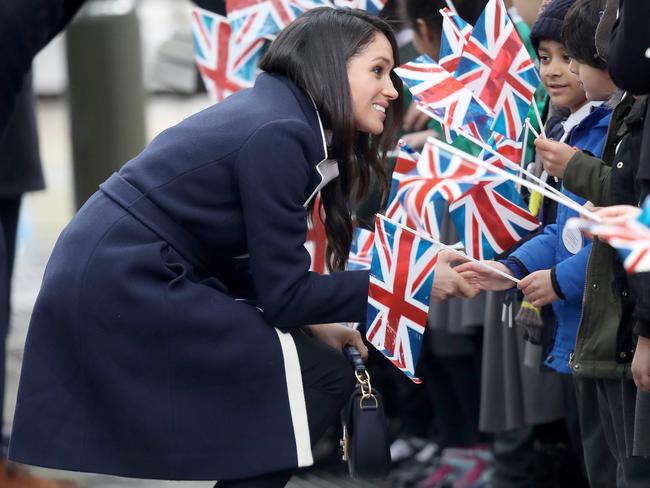 The Duchess keeping warm in the $400 J. Crew navy coat. Picture: Chris Jackson/Getty Images