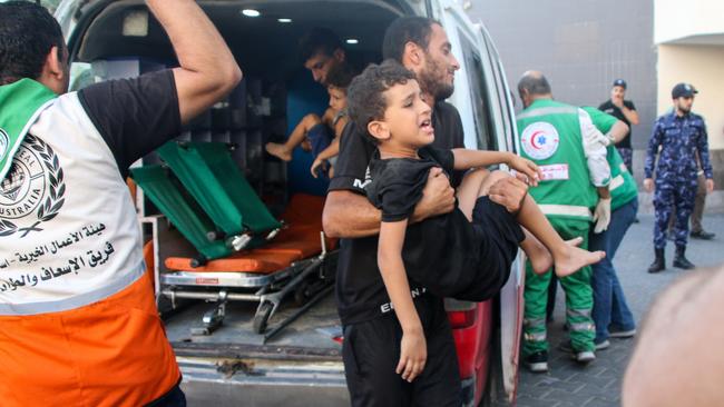 A child injured during Israeli airstrikes is taken for treatment. Picture:Getty Images