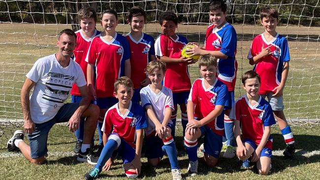 Coach Tim Green with Mooroondu Football Club's Under 9s at Birkdale. Back row: Cooper Pacey, Cade Shearsmith, Jenson Brimer, Levontae Anderson, Zeke Brasher, Declan Miethke. Front row: Marcello Mello, Joshua Green, Harley Thomas, Max Taylor-Ahlroos. Picture: Supplied.