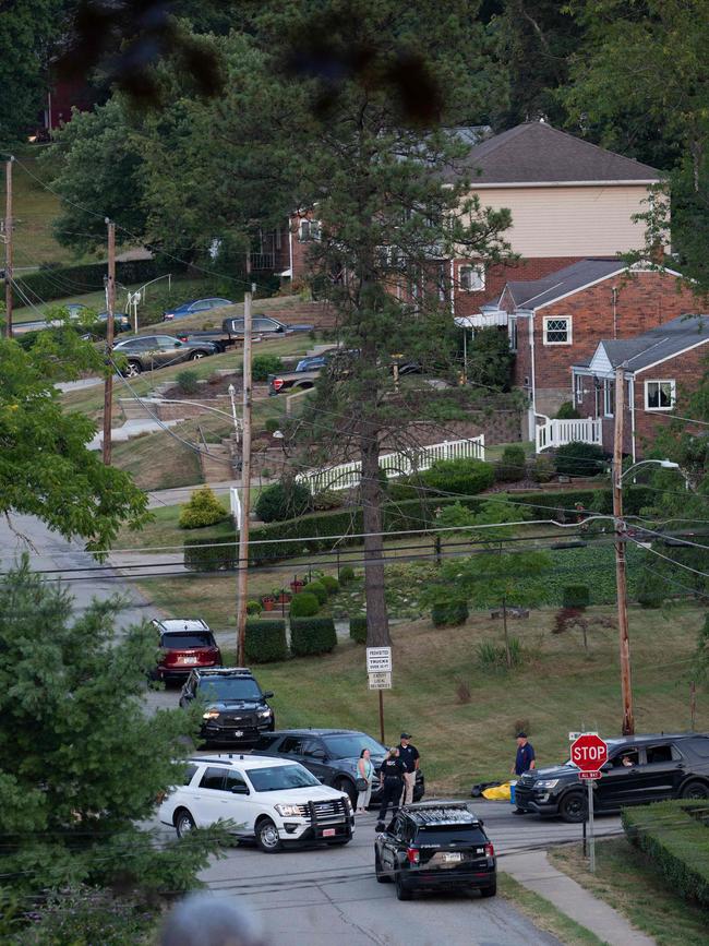 Police block off roads around his suburban home. Picture: AFP