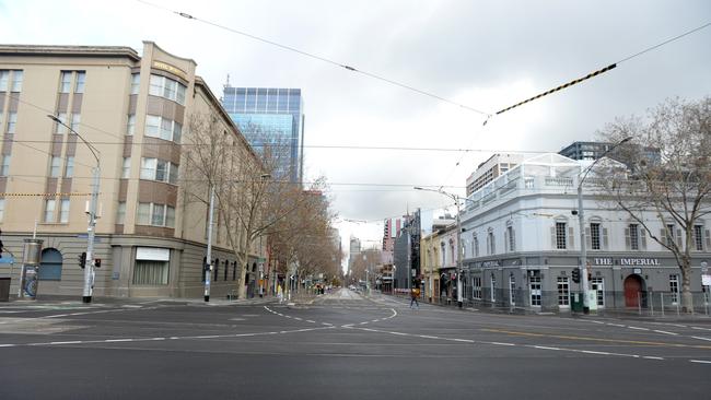 The normally busy intersection at Bourke St and Spring St. Picture: Andrew Henshaw/NCA NewsWire.