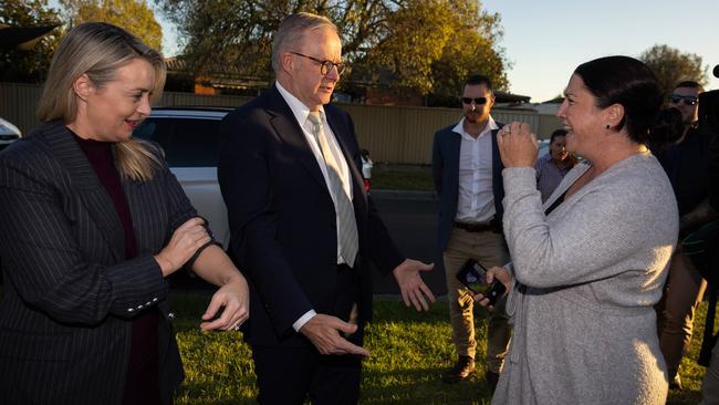 Earlier, the PM was greeted by a jubilant constituent. Picture: Jason Edwards / NewsWire