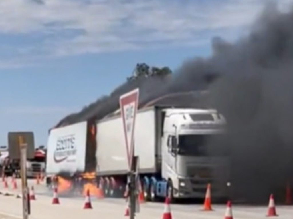 Chaos erupted on the West Australian border after four trucks were engulfed by flames.