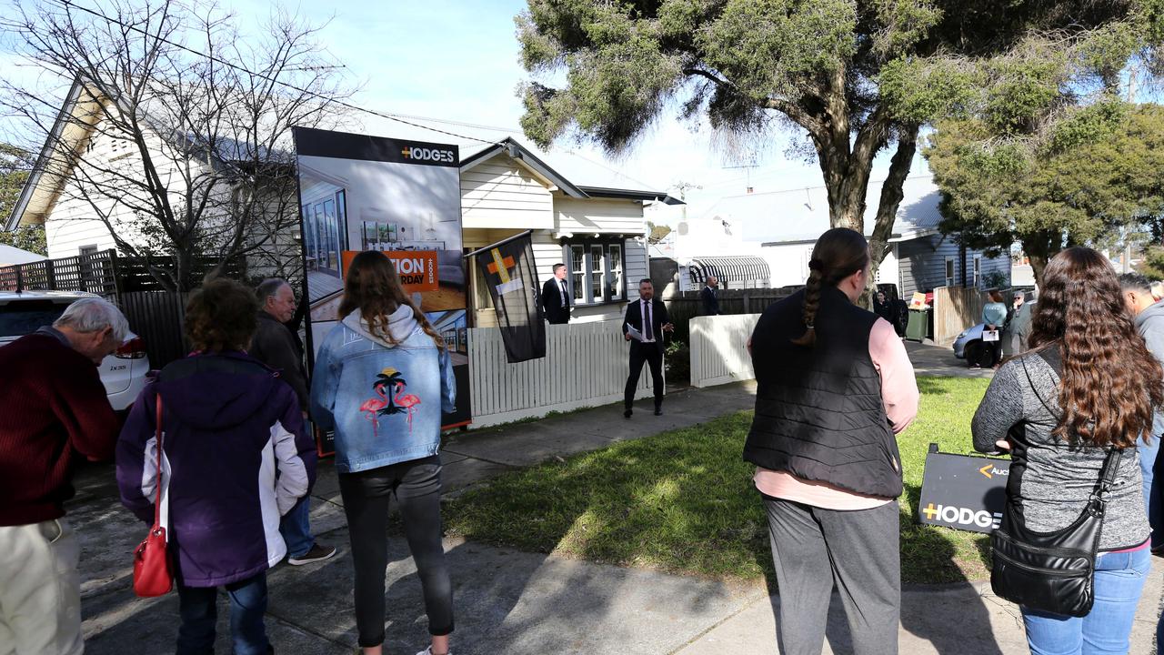 The auction crowd gathers to find out the new owners of 111 Swanston St, Geelong. Picture: Mike Dugdale