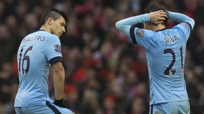 Manchester City's Sergio Aguero, left, and David Silva react.