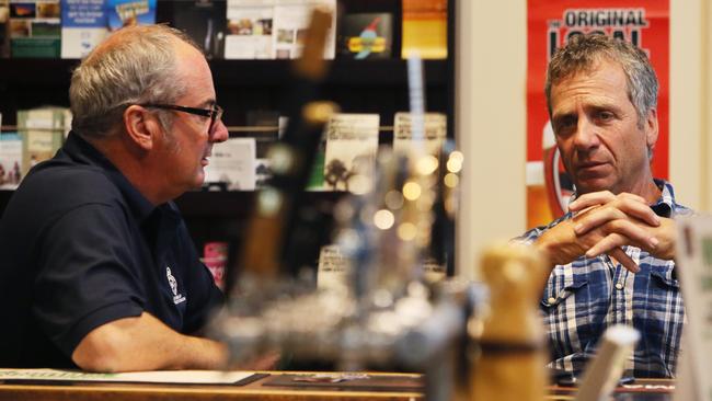 Labor's Leon Bignell and Liberal Andy Gilfillan have a beer at the Alma Hotel. Picture: AAP / Emma Brasier