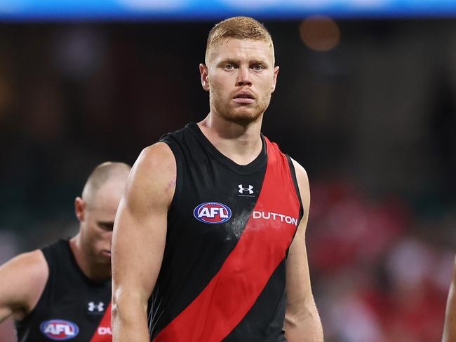 SYDNEY, AUSTRALIA - MARCH 23:  Peter Wright of the Bombers and team mates look dejected after the round two AFL match between Sydney Swans and Essendon Bombers at SCG, on March 23, 2024, in Sydney, Australia. (Photo by Matt King/AFL Photos/via Getty Images )