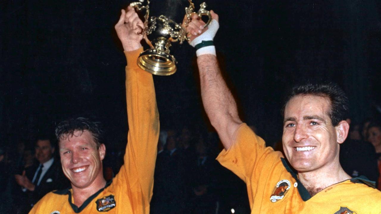 Nick Farr-Jones and David Campese hold up the World Cup in 1991 at Twickenham. Picture: AFP