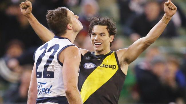 Daniel Rioli celebrates as Mitch Duncan looks on. Picture: Michael Klein