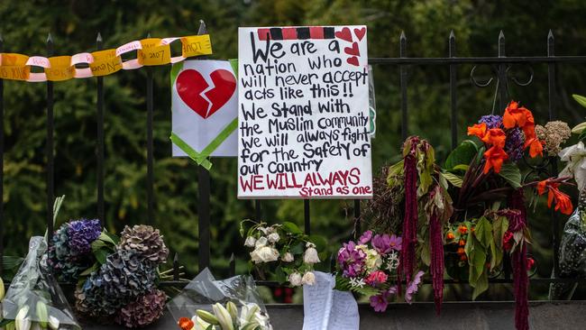 CHRISTCHURCH, NEW ZEALAND - MARCH 17: Flowers and tributes are hung on the fence of the Botanic Gardens on March 17, 2019 in Christchurch, New Zealand. 50 people are confirmed dead, with 36 injured still in hospital following shooting attacks on two mosques in Christchurch on Friday, 15 March. 41 of the victims were killed at Al Noor mosque on Deans Avenue and seven died at Linwood mosque. Another victim died later in Christchurch hospital. A 28-year-old Australian-born man, Brenton Tarrant, appeared in Christchurch District Court on Saturday charged with murder. The attack is the worst mass shooting in New Zealand's history. (Photo by Carl Court/Getty Images)