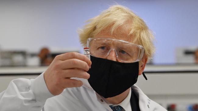 UK Prime Minister Boris Johnson with a vial of the AstraZeneca/Oxford University COVID-19 candidate vaccine on November 30. Picture: Getty Images