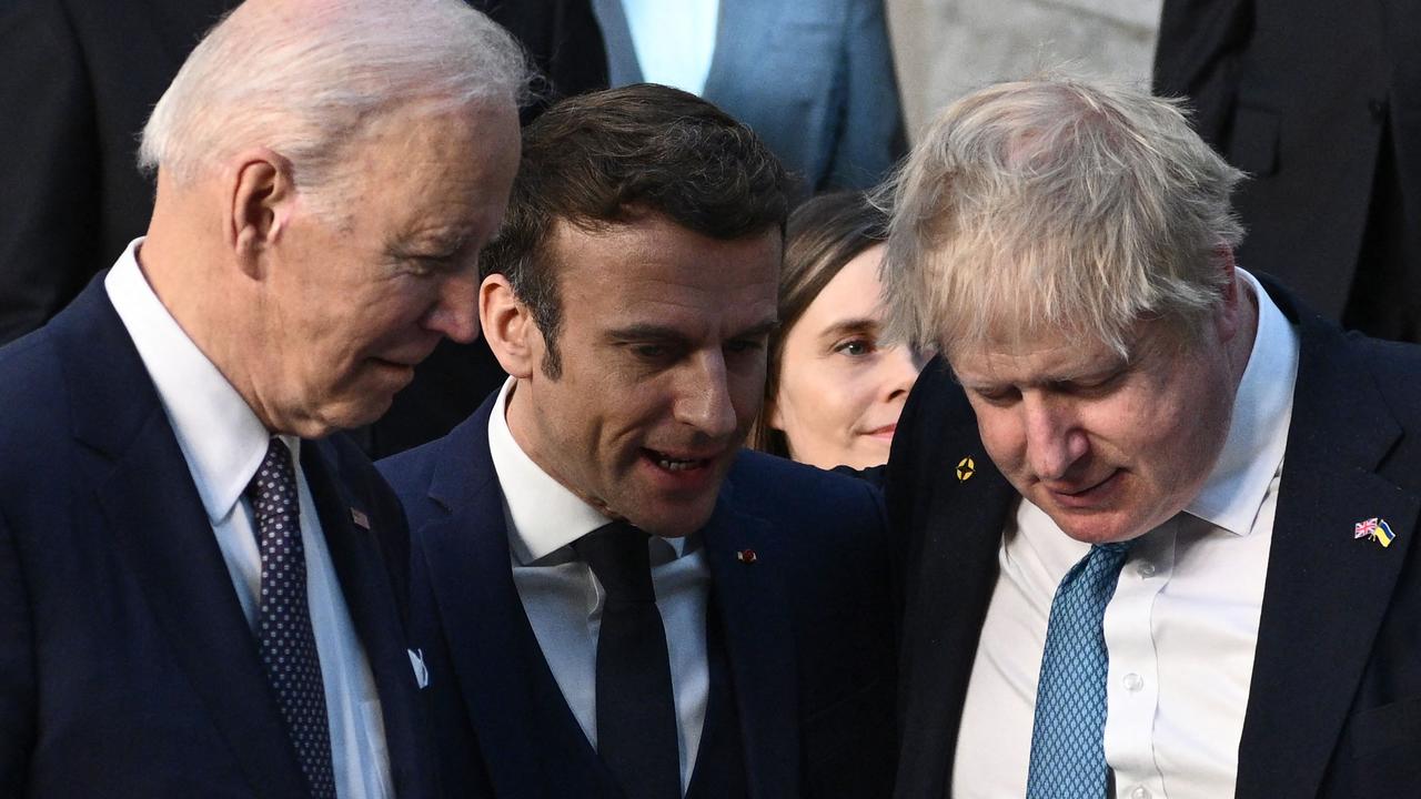 (From R) Britain's Prime Minister Boris Johnson, France's President Emmanuel Macron and US President Joe Biden talk as they arrive at NATO Headquarters. Picture: Brendan SMIALOWSKI / / AFP