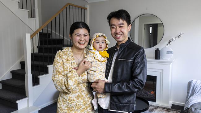 Karen He and Chang Lin with their nine-month-old baby Mia at their home in Hughesdale, which is for sale. Picture: Aaron Francis.