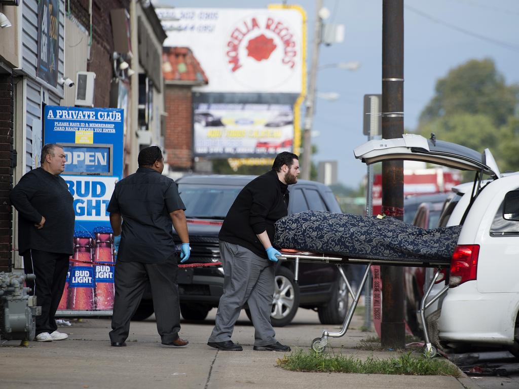 One of multiple shooting victims is loaded into a coroner's van. Picture: Tammy Ljungblad/The Kansas City Star via AP
