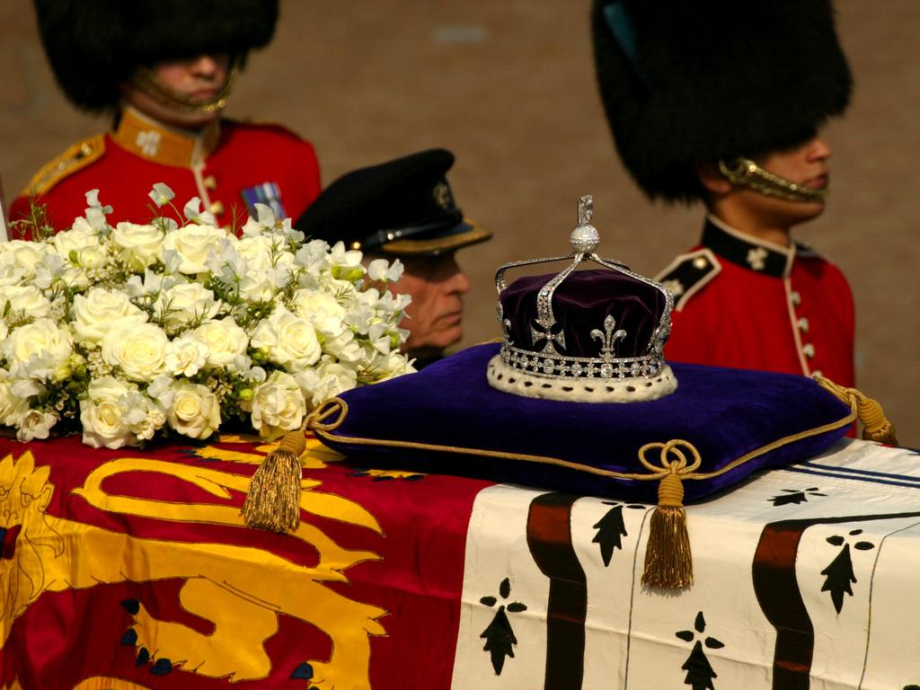 A diamond-encrusted crown bearing the Kohinoor Diamond on the Queen Mother’s coffin in 2002. Picture: Sion Touhig/Getty Images