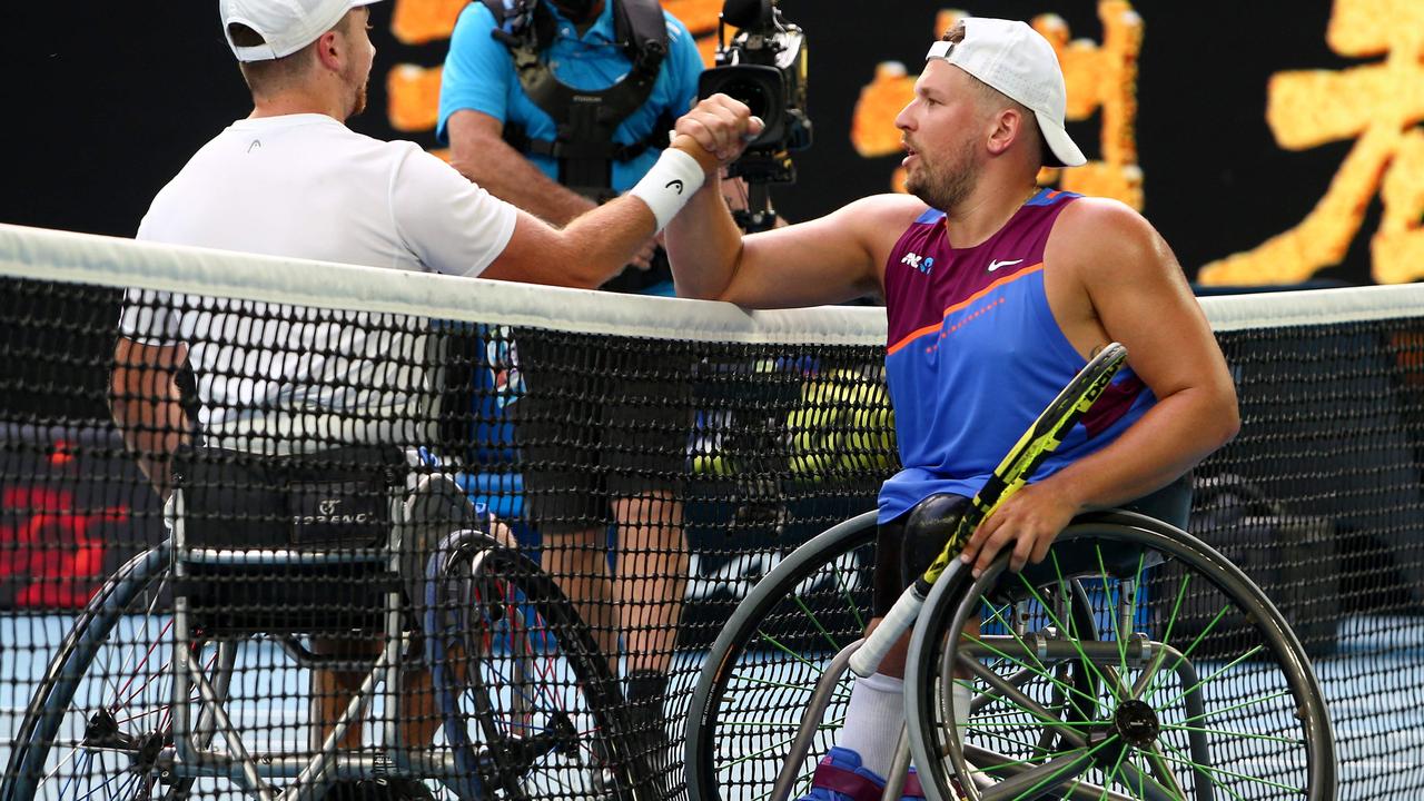 Netherlands' Sam Schroder (L) shakes hands with Australia's Dylan Alcott after their men's quad wheelchair singles final match at the Australian Open tennis tournament in Melbourne on January 27, 2022. Picture: Aaron Francis/AFP