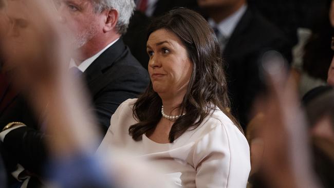 White House press secretary Sarah Huckabee Sanders listens during a news conference with President Donald Trump in the East Room of the White House. Picture: AP