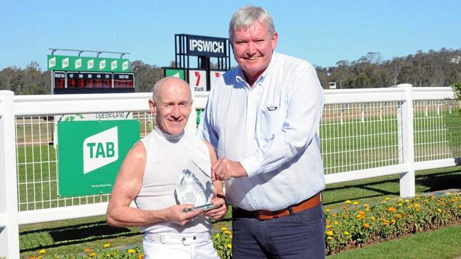 FAREWELL: Jockey Jeff Lloyd is thanked by Ipswich Turf Club chairman Wayne Patch after his final ride at the Bundamba track.