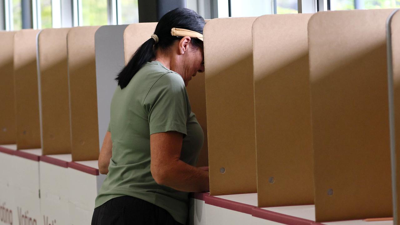 A voter gets the deed done early at Springwood. Picture: NewsWire/Tertius Pickard