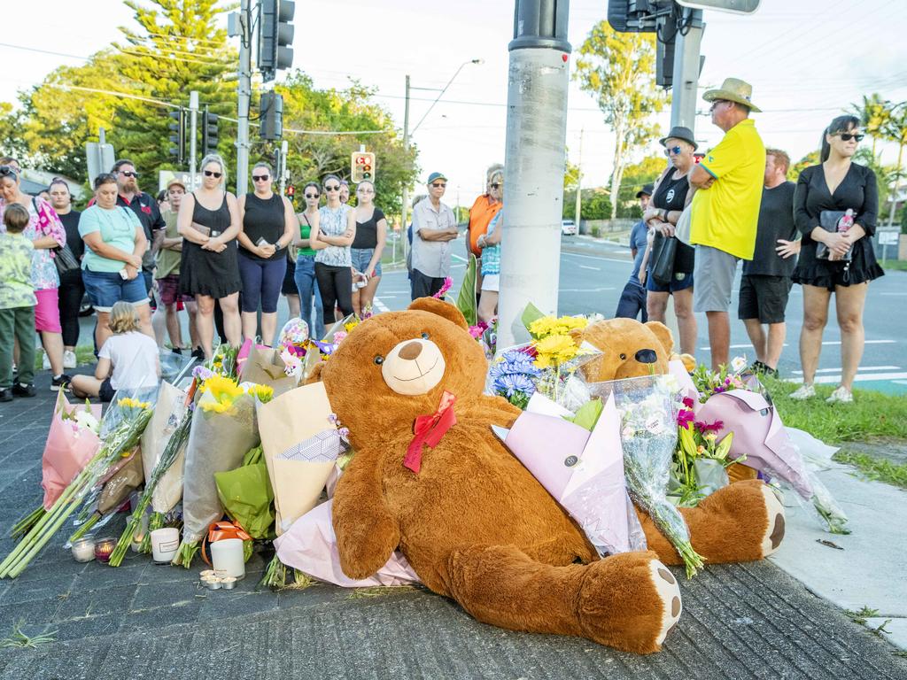 Toys, flowers and candles were left at the intersection. Picture: Richard Walker