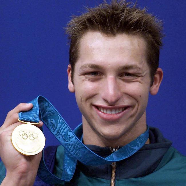 Ian Thorpe shows off the gold medal he won in the men's 400 metres freestyle final at the Sydney Olympic Games.