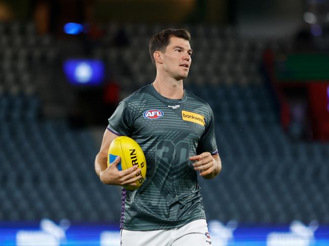 Jaeger O'Meara of the Dockers warms up before the 2024 AFL Round 2 match between the North Melbourne Kangaroos and the Fremantle Dockers. (Photo by Dylan Burns/AFL Photos via Getty Images)