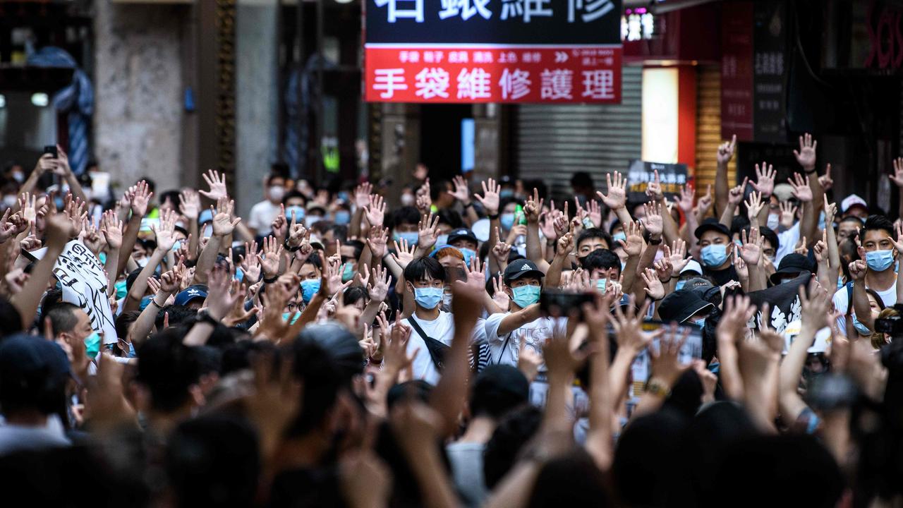 Protesters chant slogans and gesture during a rally against a new national security law in Hong Kong on July 1, 2020. Picture: Anthony WALLACE / AFP.