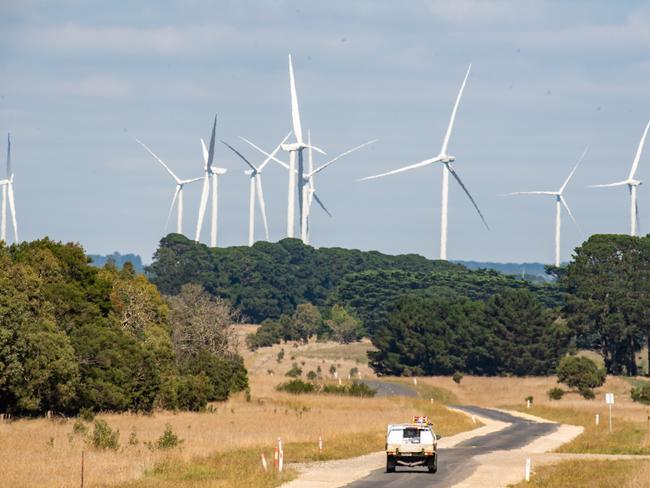 Wind Turbines for green electricity production near Ballan in Victorias West, with sheep milling around the air-conditioning units as well as birds and an eagle flying pat the blades. Picture: Jason Edwards