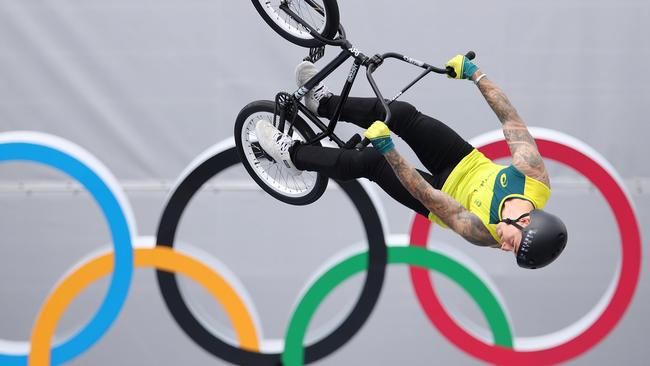 Logan Martin of Australia performs a backflip in front of the Olympic rings in Tokyo (Photo by Laurence Griffiths/Getty Images)