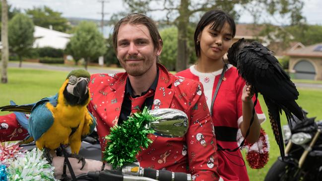 Rio (yellow and gold macaw) with Kyle McLaren and Reqeena Laili with Star (black red tail cockatoo) at the Downs Motorcycle Sport Club 2024 toy run. Sunday, December 15, 2024. Picture: Christine Schindler