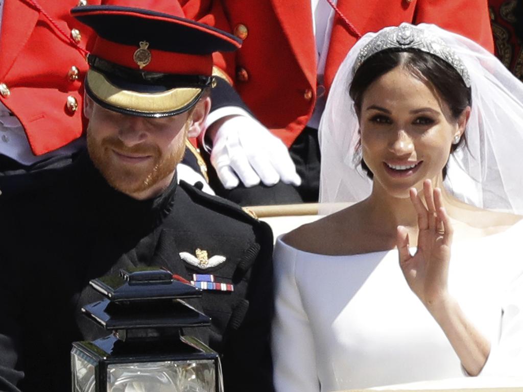 Prince Harry and Meghan Markle leave Windsor Castle in a carriage after their wedding at St. George's Chapel in Windsor, near London, England. Picture: AP Photo/Matt Dunham, file