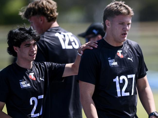 ADELAIDE, AUSTRALIA - OCTOBER 12: Evan Bradley of North Adelaide, South Australia  and  Tyler Welsh of Woodville-West Torrens South Australia  after finishing  the 2km time trial of South Australia's 2024 AFL State Draft Combine at SA  Athletics Stadium  on October 12, 2024 in Adelaide, Australia. (Photo by Mark Brake/AFL Photos/via Getty Images)