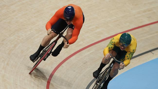 Netherlands' Harrie Lavreysen and Australia's Matthew Richardson compete in the men's track cycling sprint final race 2 for gold of the Paris 2024 Olympic Games at the Saint-Quentin-en-Yvelines National Velodrome in Montigny-le-Bretonneux, south-west of Paris, on August 9, 2024. (Photo by Thomas SAMSON / AFP)