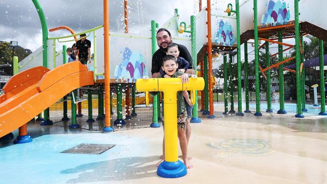 Ingenia Cairns Coconut holiday park has upgraded its very popular splash park, with the original splash park being replaced after 15 years. Jono Crago from Adelaide and his sons Carter Crago, 20 months, and Lennox Crago enjoy the new splash park at Cairns Coconut holiday park. Picture: Brendan Radke