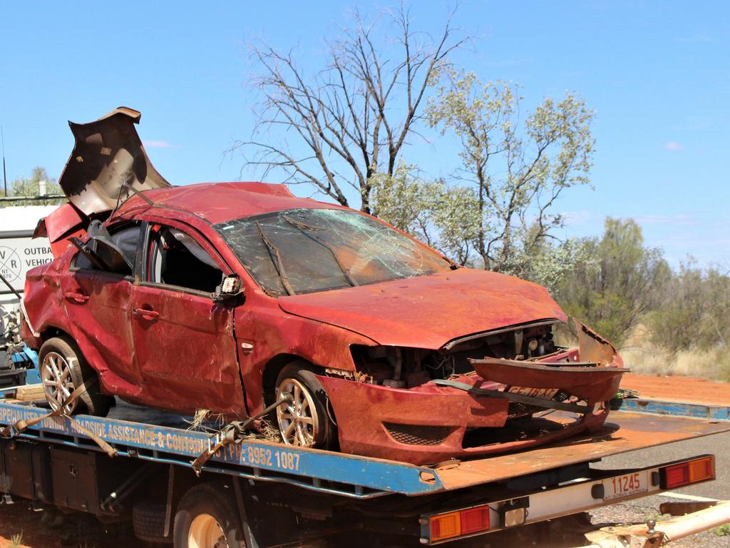 A tow truck takes away the destroyed vehicle at Yulara. Picture: Jason Walls