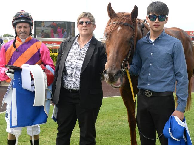 Robbie Fradd, Desleigh Forster and strapper Woosung Ju with Too Good To Refuse after winning at Doomben in September last year. Picture: Grant Peters, Trackside Photography