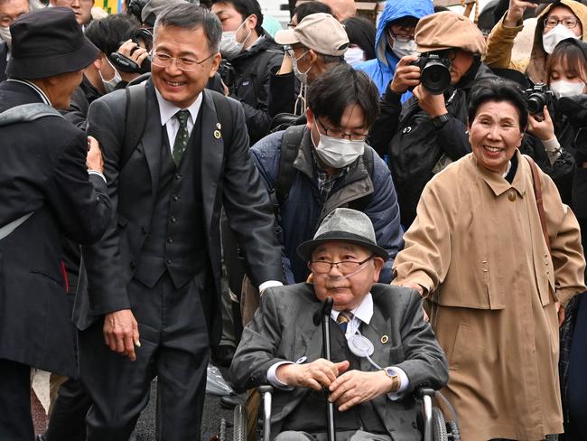 Hideko Hakamada (front-R) and supporters of her brother Iwao Hakamada, enter the Tokyo High Court on March 13, 2023. Picture: AFP.