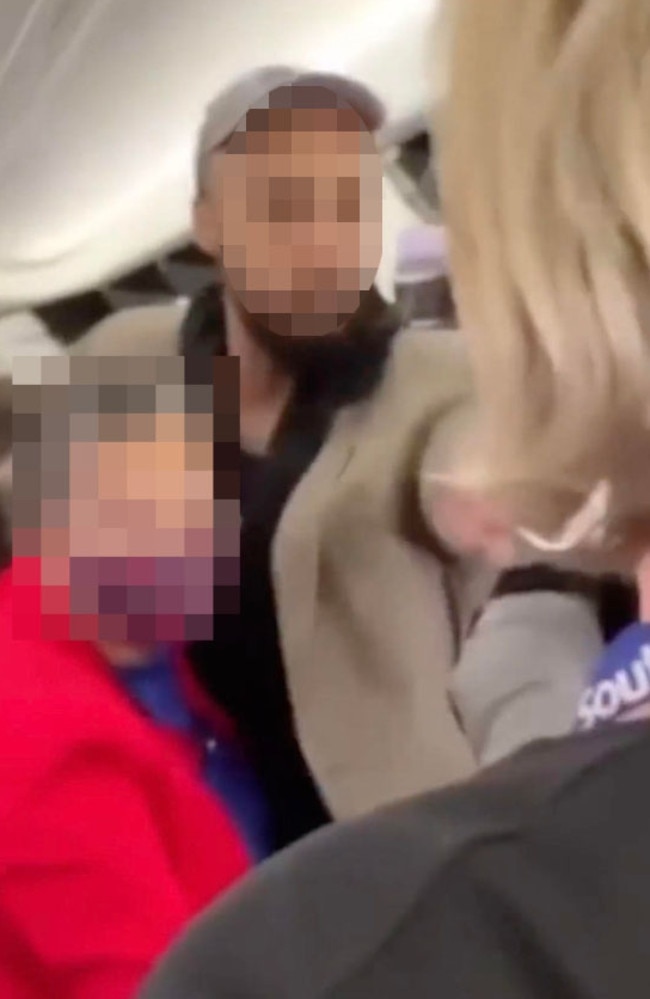 The passenger filming said the fight began after one man accidentally bumped into another’s wife. Picture: Twitter/DeL2000