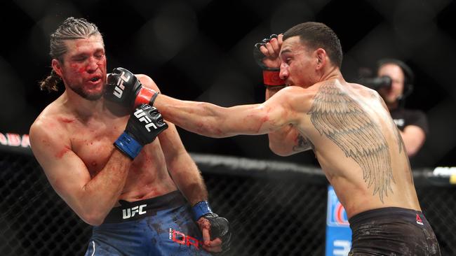 Max Holloway (R) brings the hurt against Brian Ortega. Picture: Getty Images